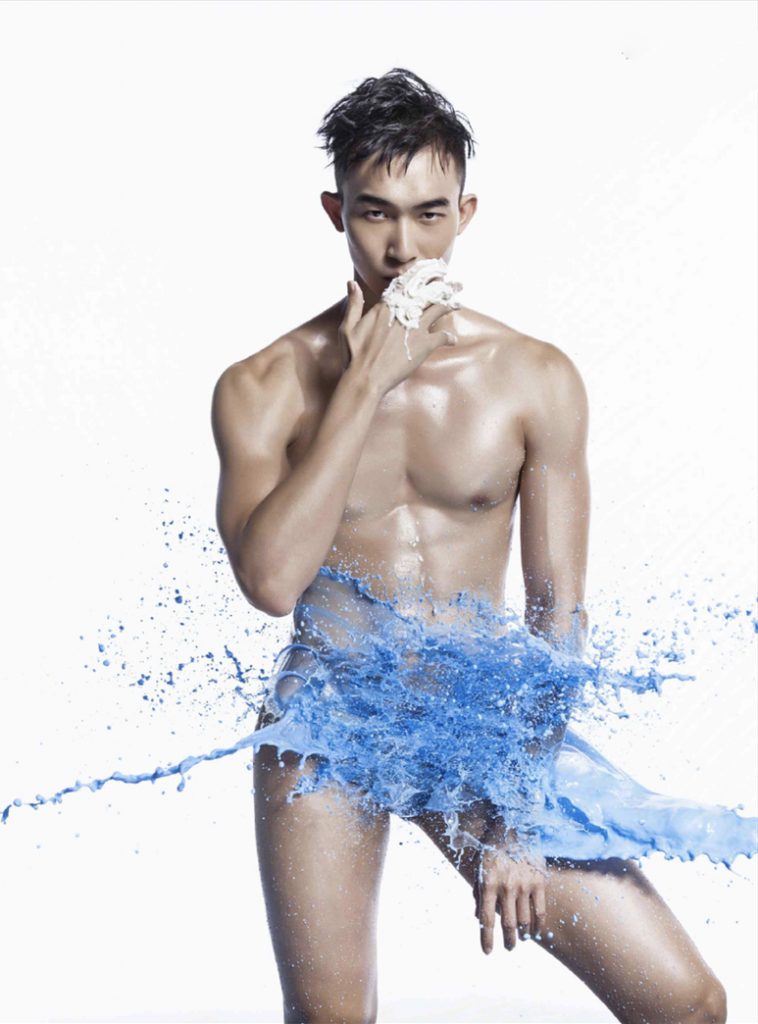 Nude Asian man in a color wave
