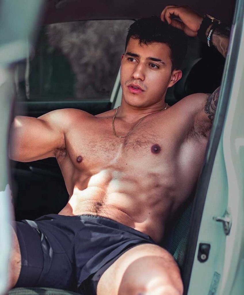 homoerotic male model almost naked reclining on couch